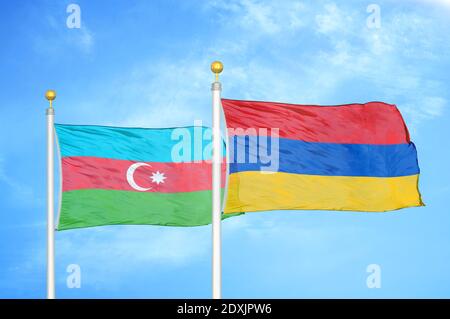 Azerbaijan and Armenia two flags on flagpoles and blue sky Stock Photo