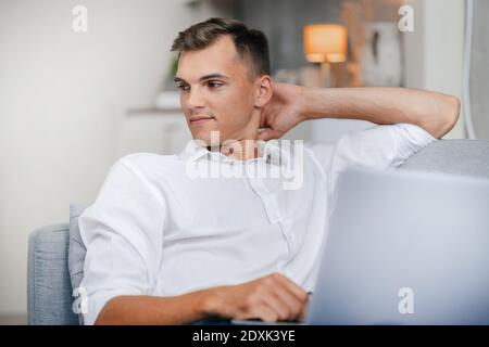 attractive young man using his laptop . people and technology. Stock Photo