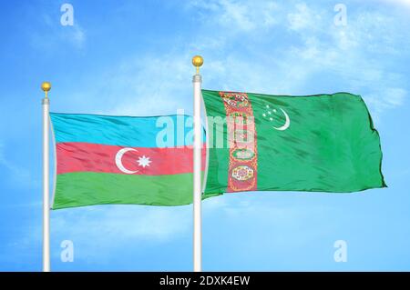 Azerbaijan and Turkmenistan two flags on flagpoles and blue sky Stock Photo