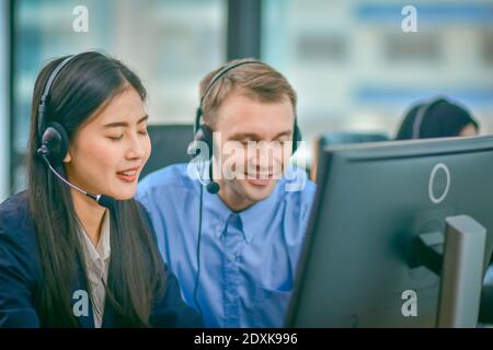 Visually impaired Call center using headphone contract communication with customer,Visually impaired Normal work with human equality Stock Photo