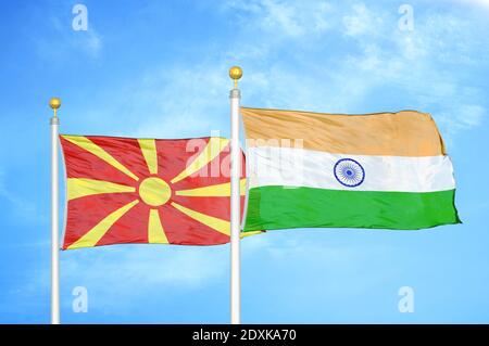 North Macedonia and India two flags on flagpoles and blue sky Stock Photo