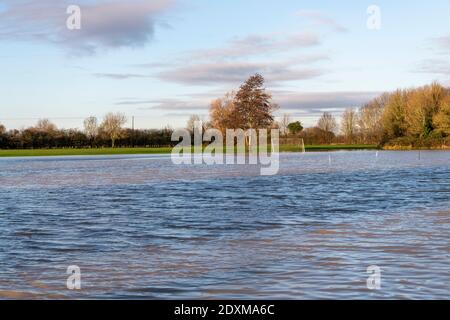 Willingham Cambridgeshire, UK. 24th Dec, 2020. The recreation ground is flooded as many areas of the village are underwater today after heavy and persistent rain yesterday. Flooding affected low lying areas and where drainage systems failed to cope with the large volume of water. Credit: Julian Eales/Alamy Live News Stock Photo