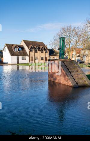 Willingham Cambridgeshire, UK. 24th Dec, 2020. Many areas of the village are underwater today after heavy and persistent rain yesterday. Flooding affected low lying areas and where drainage systems failed to cope with the large volume of water. Credit: Julian Eales/Alamy Live News Stock Photo