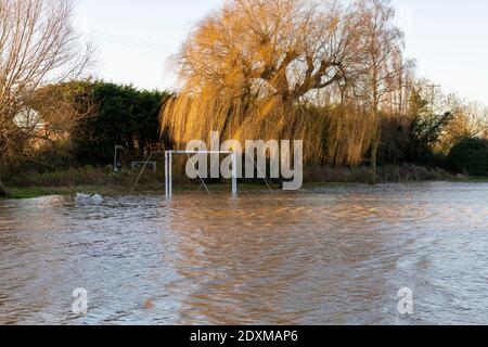 Willingham Cambridgeshire, UK. 24th Dec, 2020. The recreation ground is flooded as many areas of the village are underwater today after heavy and persistent rain yesterday. Flooding affected low lying areas and where drainage systems failed to cope with the large volume of water. Credit: Julian Eales/Alamy Live News Stock Photo