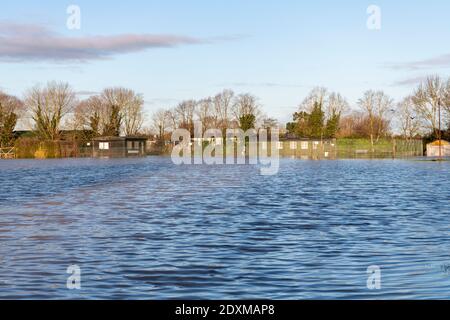 Willingham Cambridgeshire, UK. 24th Dec, 2020. The recreation ground is flooded as many areas of the village are underwater today after heavy and persistent rain yesterday. Flooding affected low lying areas and where drainage systems failed to cope with the large volume of water. Credit: Julian Eales/Alamy Live News Stock Photo