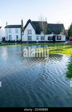 Willingham Cambridgeshire, UK. 24th Dec, 2020. Many areas of the village are underwater today after heavy and persistent rain yesterday. Flooding affected low lying areas and where drainage systems failed to cope with the large volume of water. Credit: Julian Eales/Alamy Live News Stock Photo