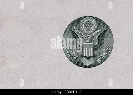 cut eagle sign from back side of 1 dollar bill on white background Stock Photo