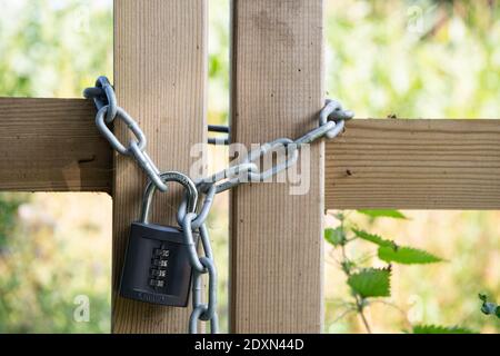Gates padlocked up with a heavy duty padlock at the entrance to a field. Cumbria, UK. Stock Photo
