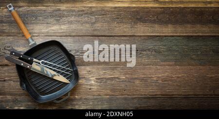 grill pan on wooden old background Stock Photo