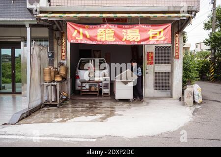 Hsinchu / Taiwan - March 20, 2020: Taiwanese man setting a dumpling shop in the garage of his house Stock Photo
