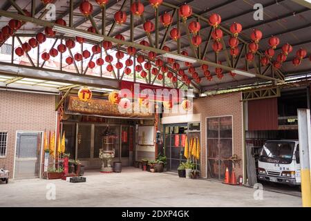 Hsinchu / Taiwan - March 20, 2020: small taoist temple with red lanterns in rural area of Taiwan Stock Photo