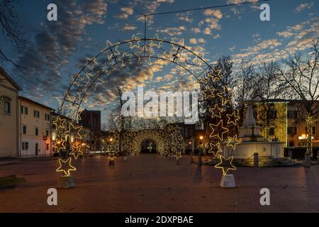 Piazza Vittorio Emanuele II square in the center of Bientina, Pisa, Tuscany, Italy, fully decked out with Christmas lights for the seasonal holidays Stock Photo