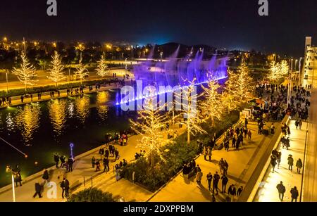 Athens, Greece - December 15, 2019: Night view of colourful dancing water fountain event at Stavros Niarchos Foundation Cultural Center (SNFCC) in Ath Stock Photo