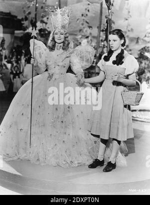 BILLIE BURKE as Glinda and JUDY GARLAND as Dorothy in THE WIZARD OF OZ 1939 director VICTOR FLEMING book Frank L. Baum costumes Gilbert Adrian Metro Goldwyn Mayer Stock Photo