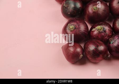 sweet red onions on background Stock Photo
