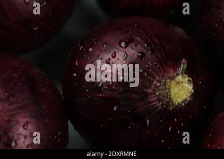 sweet red onions on background Stock Photo