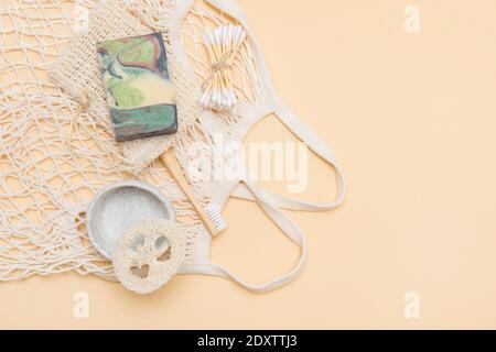 Zero waste bathroom accessories on camel color background. Natural eco bamboo product. Plastic free beauty essentials. Stock Photo