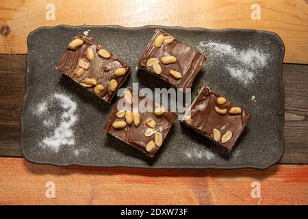 A delicious trey of Salted Peanut Nanaimo Bars, tasty festive Christmas treats Stock Photo