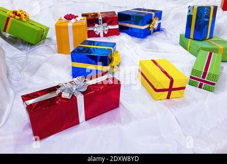 colorful gift boxes on stilized snow Stock Photo
