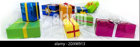 colorful gift boxes on stilized snow Stock Photo