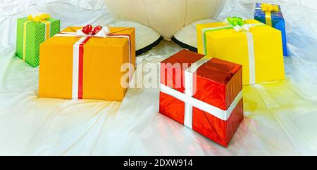 colorful gift boxes on stilized snow Stock Photo