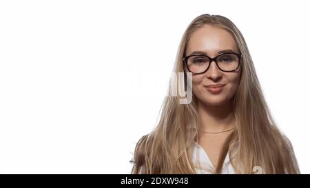 Beautiful girl in eye glasses with long straight blond hair looking at the camera wearing white medical uniform isolated on white background Stock Photo