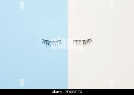 False eyelashes on white and blue background Stock Photo