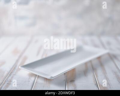 Rectangular plate on white table Stock Photo