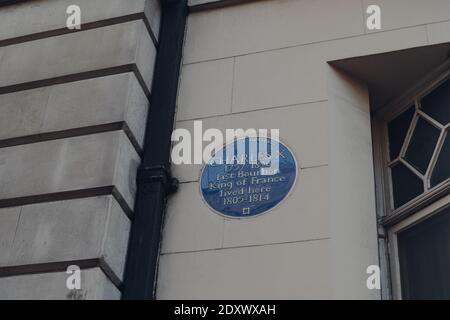 London, UK - December 5, 2020: Memorial plaque on a building in Mayfair, an affluent area in the West End of London in the City of Westminster borough Stock Photo