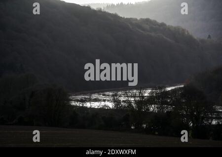 The River Wye bursts its bank in overnight flooding along the Wye Valley, Wales. River levels may yet get higher. Stock Photo