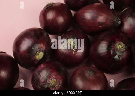 sweet red onions on background Stock Photo