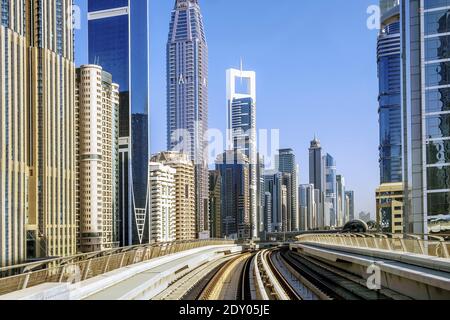 Dubai metro railway on a skyscrapers background, United Arab Emirates