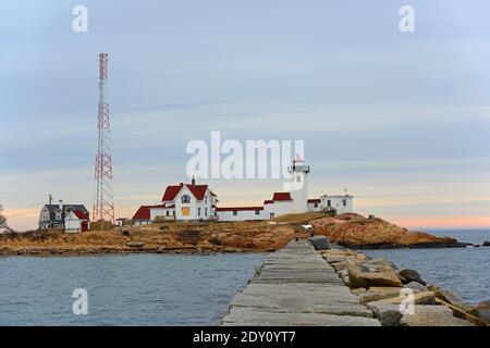 Eastern Point Lighthouse at sunset, Cape Ann, northeastern Massachusetts MA, USA. This historic lighthouse was built in 1832 on the Gloucester Harbor Stock Photo