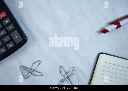 Notebook with pencil and calculator on office desk Stock Photo