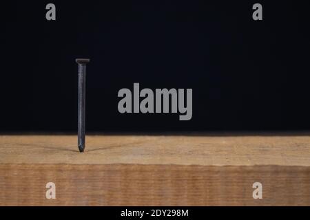 Hammer with nail on black background Stock Photo