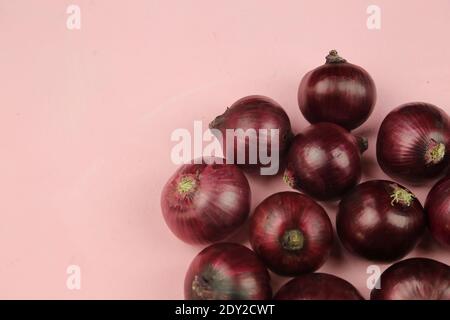 sweet red onions on background Stock Photo