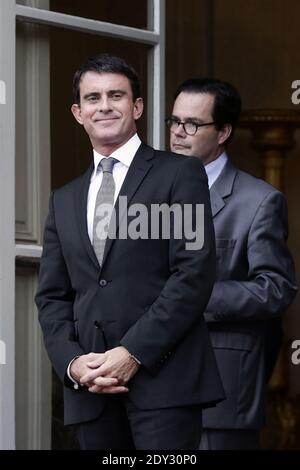 Prime Minister Manuel Valls, flanked by commander of L'Hermione Yves ...