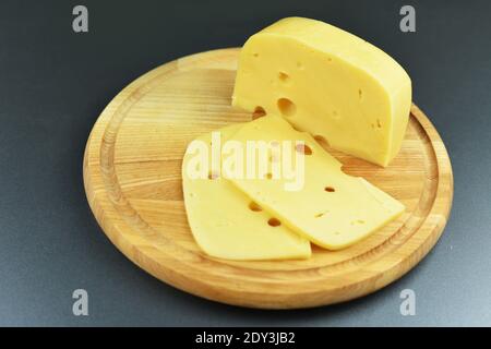 Dutch cheese fresh on a wooden board Stock Photo