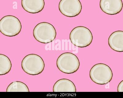 minimalistic tropical pattern with exotic coconut fruit on a pink background Stock Photo