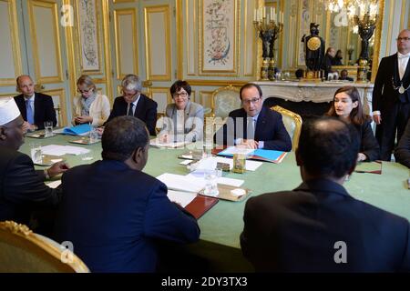 French President Francois Hollande alongside Secretary of State for Development and Francophonie Annick Girardin (L) during his talks with Somali President Hassan Sheikh Mohamud at the Elysee Palace in Paris, France on October 15, 2014. Photo Pool by Jacques Witt/ABACAPRESS.COM Stock Photo