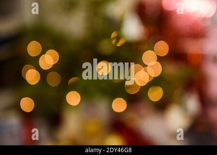 Blurred Christmas bokeh lights. Abstract holiday background. Stock Photo