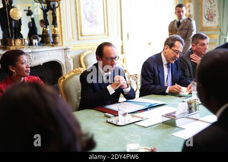 French President Francois Hollande flanked by Minister of French Overseas Territories George Pau-Langevin during talks with his Haitian counterpart Michel Martelly, at the Elysee Palace in Paris, France on October 31, 2014. Photo Pool by Hamilton/ABACAPRESS.COM Stock Photo