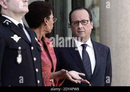 French President Francois Hollande talks with Minister of Overseas Territories George Pau-Langevin after a meeting with his Haitian counterpart Michel Martelly at the Elysee Presidential Palace in Paris, France on October 31, 2014. Photo by Stephane Lemouton/ABACAPRESS.COM Stock Photo