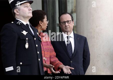 French President Francois Hollande talks with Minister of Overseas Territories George Pau-Langevin after a meeting with his Haitian counterpart Michel Martelly at the Elysee Presidential Palace in Paris, France on October 31, 2014. Photo by Stephane Lemouton/ABACAPRESS.COM Stock Photo