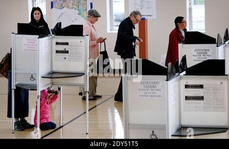 Voters fill out their ballot at a polling station during the mid-term elections November 4, 2014 in North East, Washington DC, USA. Today Americans head to the polls to cast their vote in the mid-term elections, which will decide whether Republicans or Democrats will control the Senate. Photo by Olivier Douliery/ABACAPRESS.COM Stock Photo