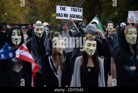 Anonymous and pro-democracy protesters wearing Guy Fawkes masks walk in front of the White House in Washington, DC, USA, for the Million Mask March, November 5, 2014. The Million Mask March is sweeping the globe across Wednesday as demonstrators protest against austerity, mass surveillance and oppression. Photo by Olivier Douliery/ABACAPRESS.COM