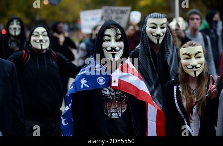 Anonymous and pro-democracy protesters wearing Guy Fawkes masks walk in front of the White House in Washington, DC, USA, for the Million Mask March, November 5, 2014. The Million Mask March is sweeping the globe across Wednesday as demonstrators protest against austerity, mass surveillance and oppression. Photo by Olivier Douliery/ABACAPRESS.COM Stock Photo