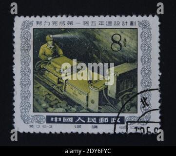 KHARKIV / UKRAINE - SEPTEMBER 3, 2020: Vintage stamp printed by People's Republic of China, a factory worker, circa 1955 Stock Photo