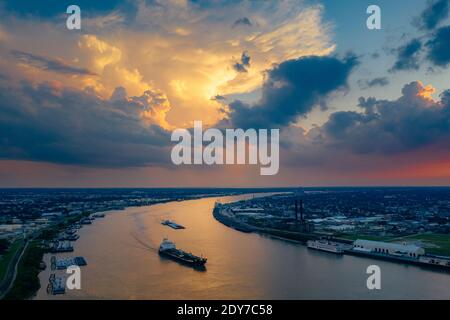 A ship is on the river near New Orleans in the evening from above Stock Photo