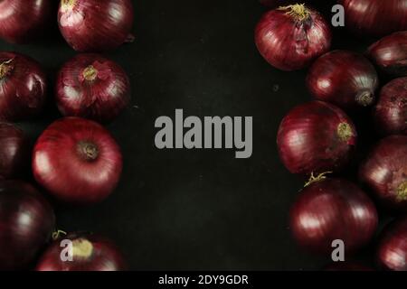 sweet red onions on background Stock Photo